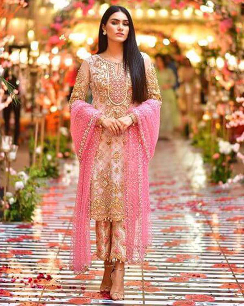 Picture of Roshanay dolled up in a pretty ivory, gold and pink combination, paired with printed pants and a net chann dupatta