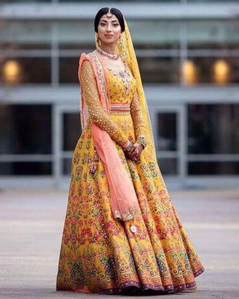 Picture of Sara wears one of the most loved numbers from our vibrant lehnga cholis, for her mehndi in USA