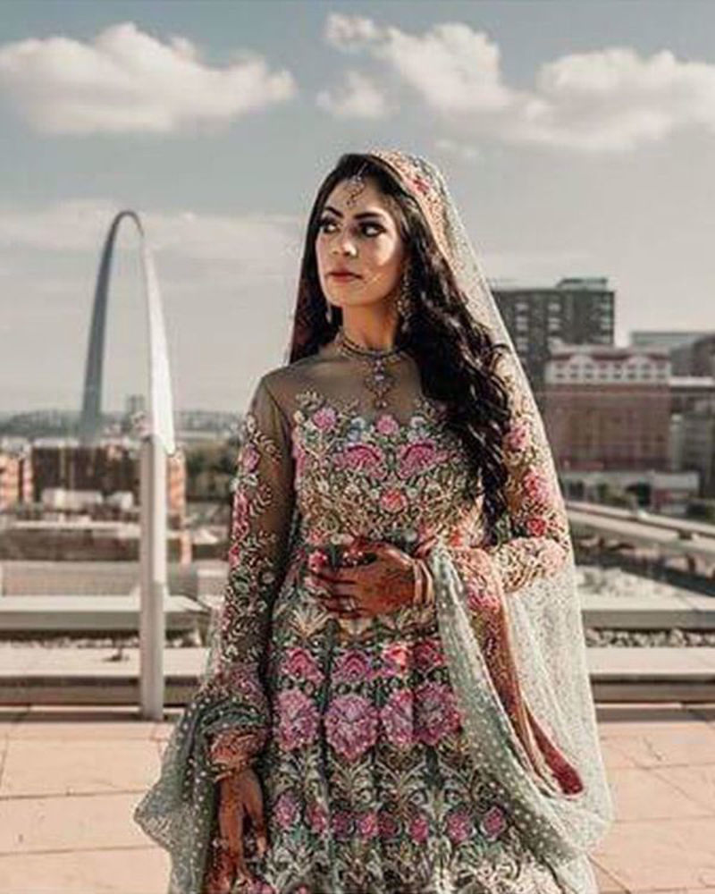 Picture of Yamna Sheikh in a divinely detailed mint blue and pink bridal lehnga and peplum