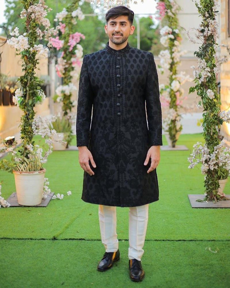 Picture of Black-on-black handworked details on the collar add a touch of glitz to our black embroidered sherwani.