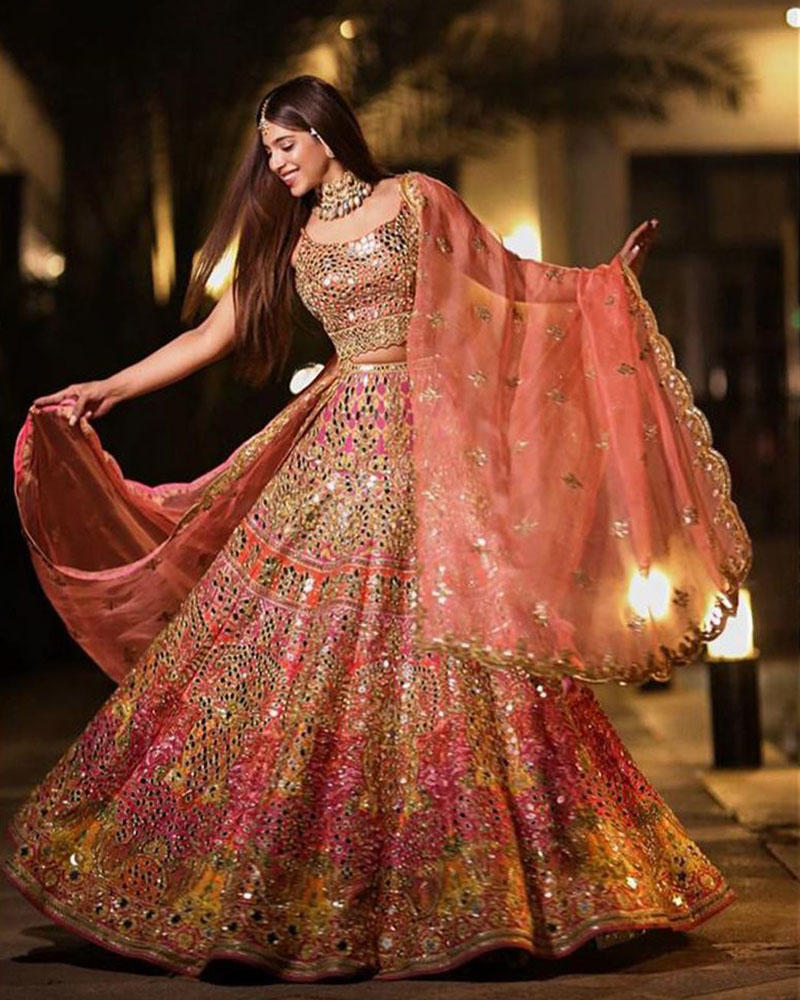 Picture of Sonya Hussyn shines in our most loved and colourful mirror work lehnga choli, paired with a lovely organza dupatta.