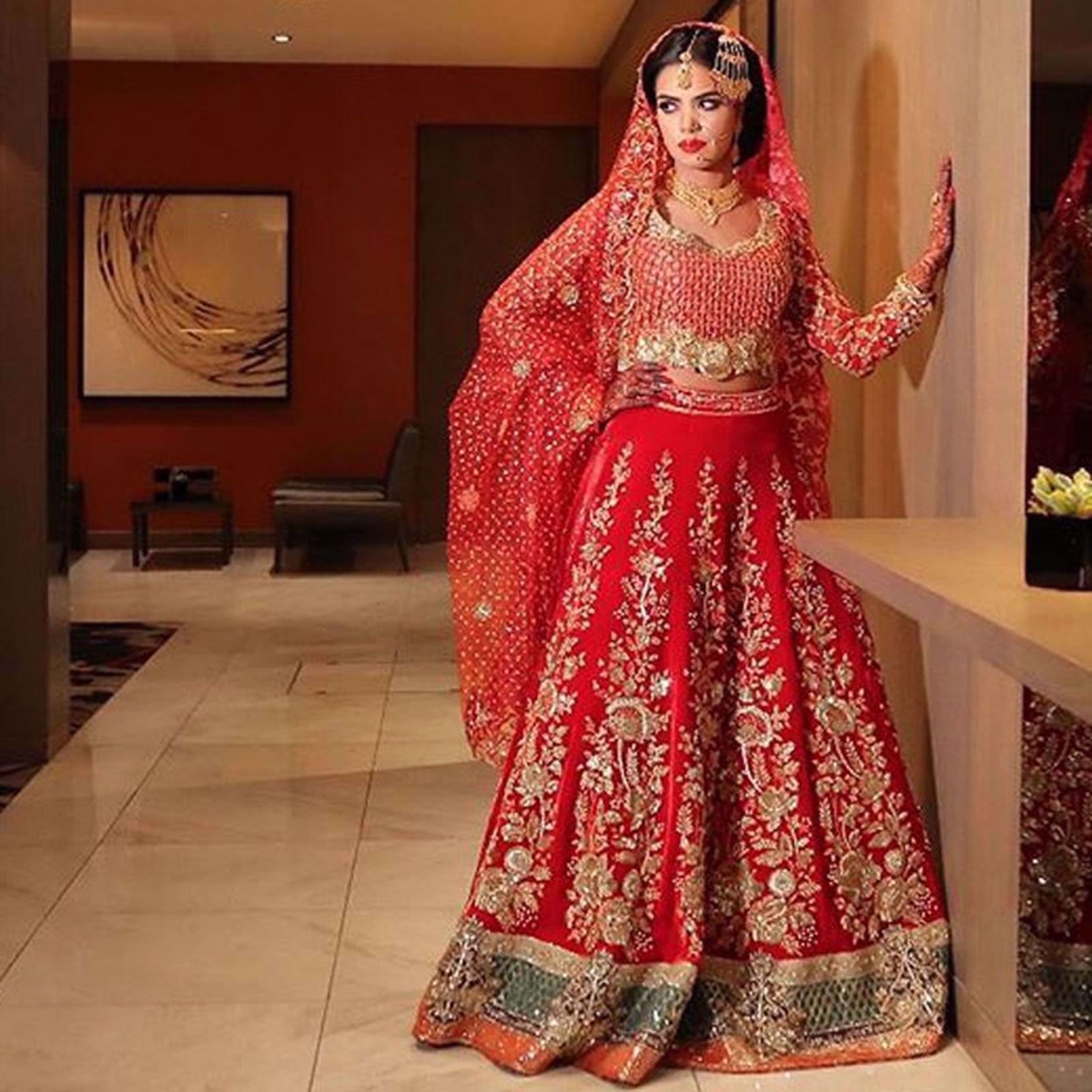 Picture of SUMMAYAH ELAHI IN A RED LEHNGA BY NOMI ANSARI