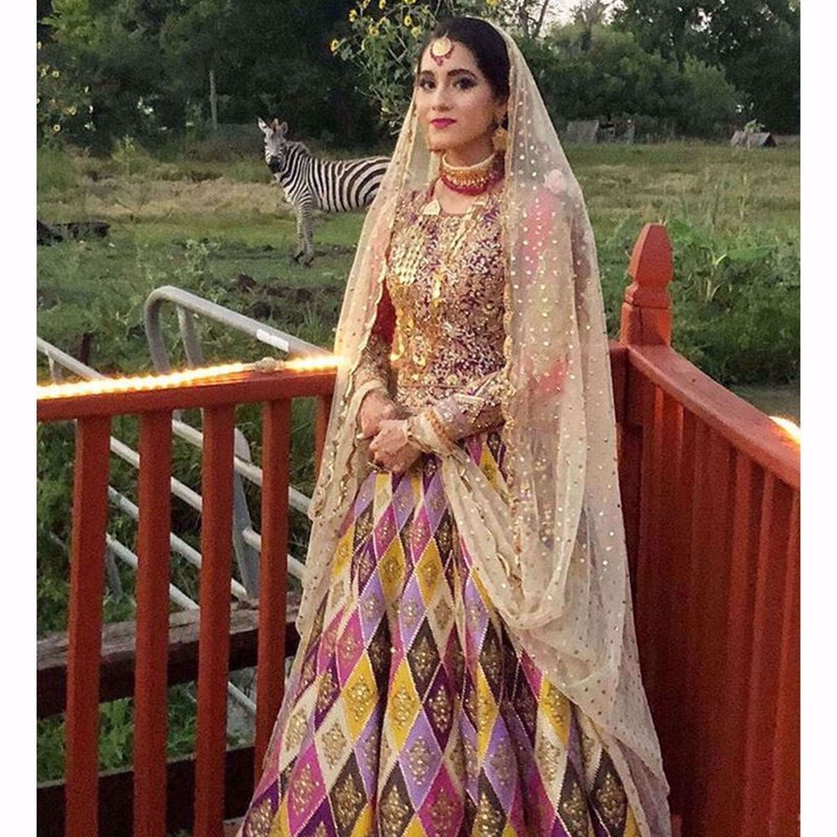 Picture of BEAUTIFUL MEHNDI BRIDE MAHIN ANSARI WEARS OUR ROSE QUARTS LEHENGA PAIRED WITH AND HEAVY EMBROIDERED CHOLI