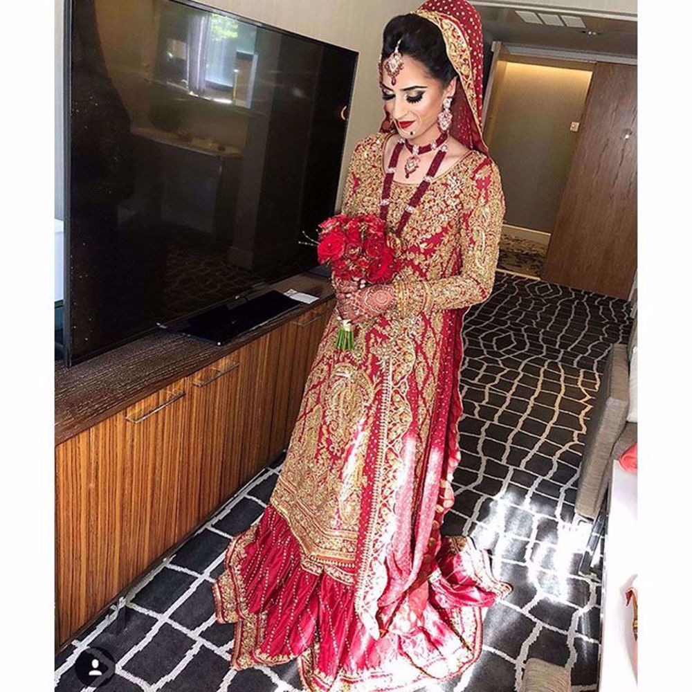 Picture of THE BEAUTIFUL BRIDE NABA IN A TRADITIONAL RED NOMI ANSARI BRIDAL