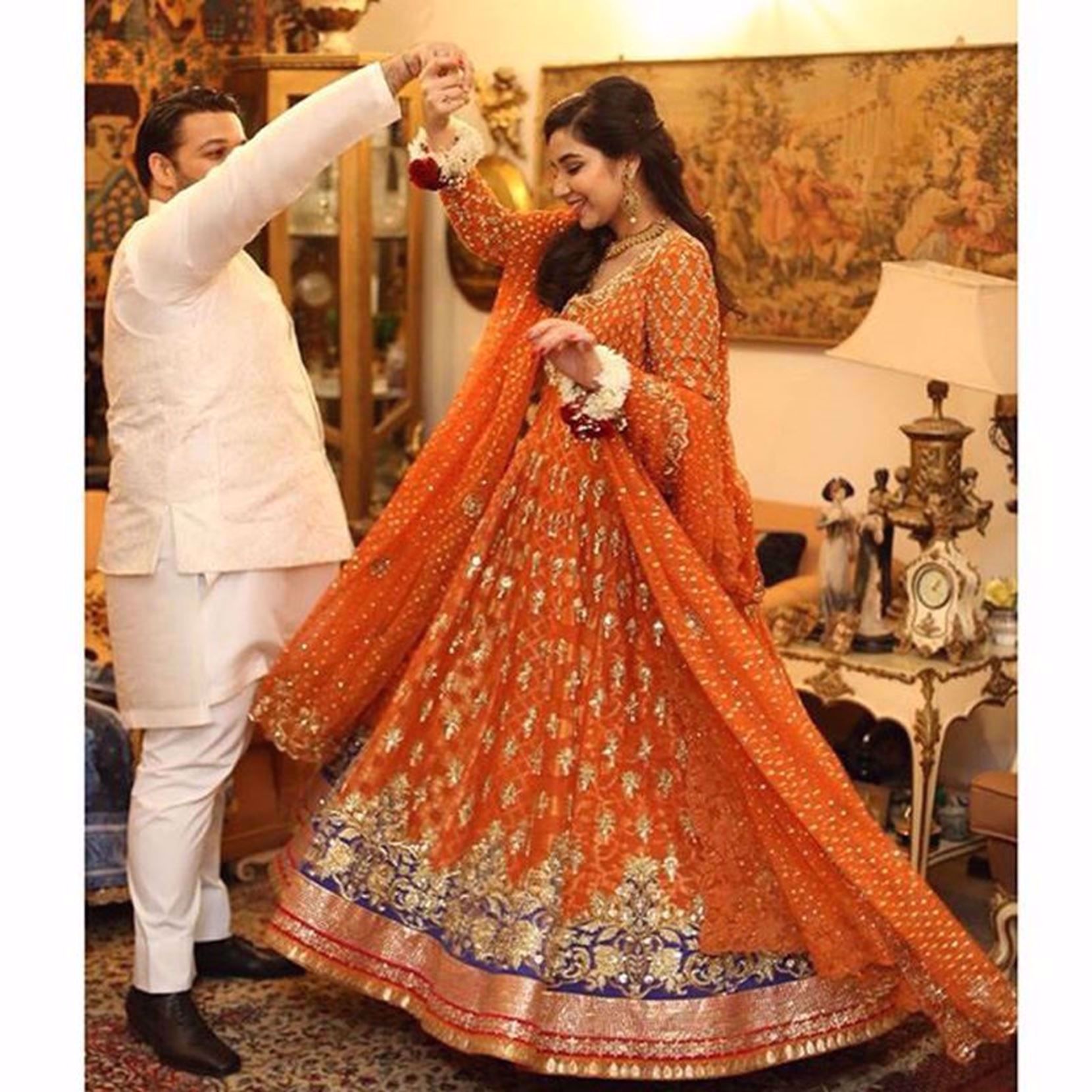 Picture of MASHAL ZAMAN IN AN A SUN KISSED BURNT ORANGE ANARKALI