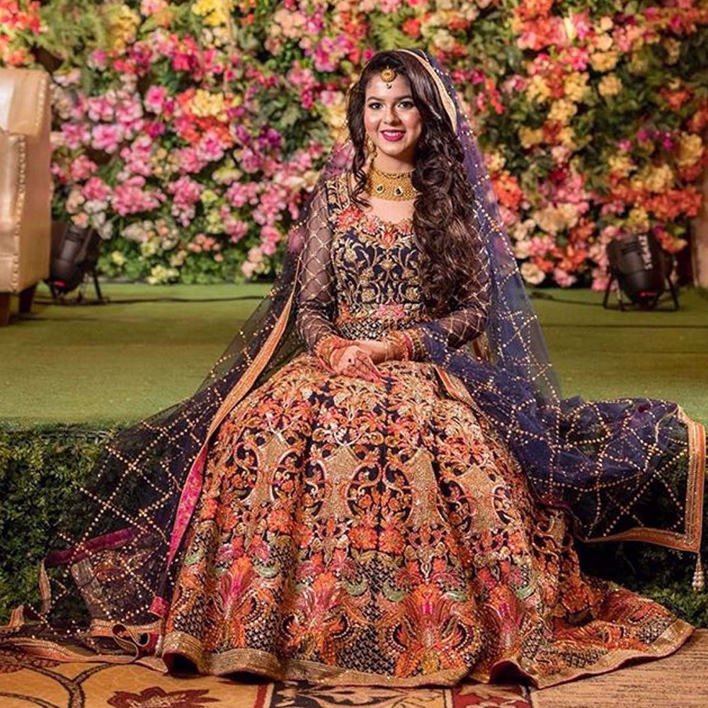 Picture of MaishaKarim from Dhaka radiates the true personification of the joyful bride in our creation Bringing out her inner glow, she dazzles in this navy ensemble.
