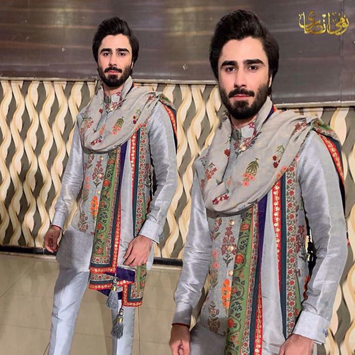 Picture of nabeelzuberiofficia spotted wearing a printed silk tailored kurta and waistcoat paired with a printed shawl and straight silk pants by #nomiansari