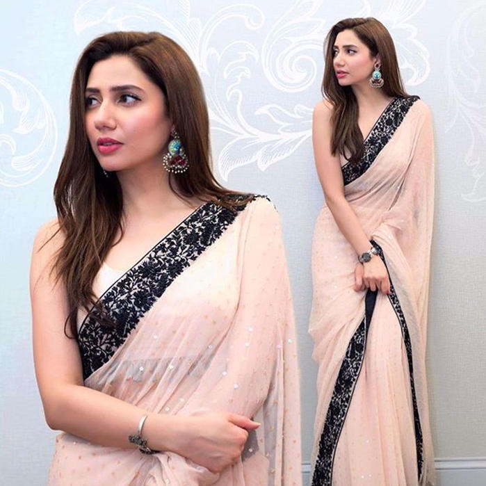 Picture of Mahira Khan looks breathtaking in a custom #NomiAnsari powder pink sari that blends sublime hues and intricate patterning in secluded patterns