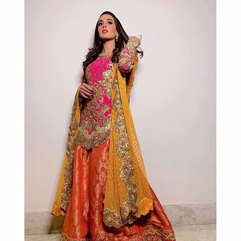 Picture of Our favourite and the most talented girl @iiqraaziz on the sets of #sunochanda in a #nomiansari signature vibrant outfit.