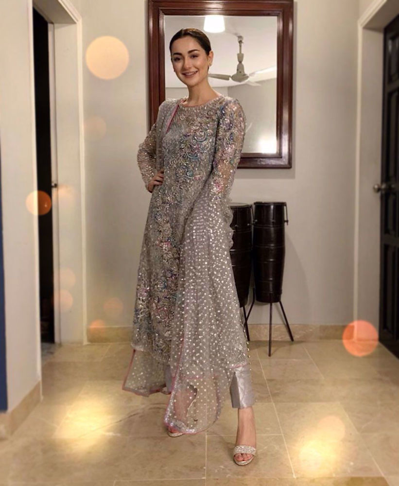 Picture of Hania Aamir lit up the night in a super sparkly number from our latest formals range! With a printed lining, the net features an intricate sequinned jaal with a floral pattern atop it