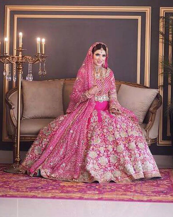 Picture of Custom made for this beautiful bride, our rani pink bridal glistens with silver gold kaam, and accents of turquoise!