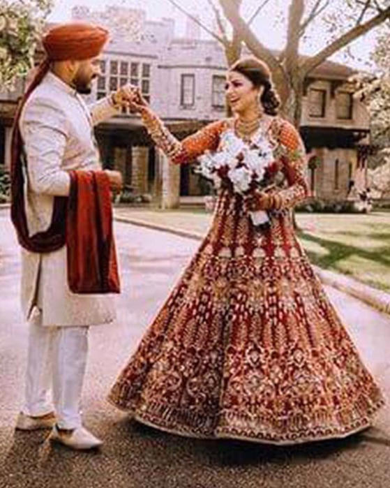 Picture of Naba Shaukat wears one of our most loved traditional dark red bridal for her event in Michigan