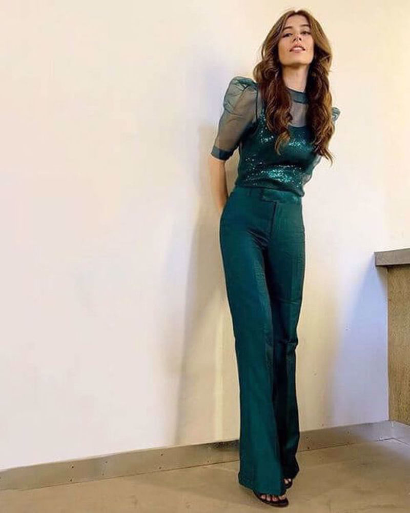 Picture of Saira wears a custom made Nomi Ansari outfit, in a gorgeous shade of emerald green