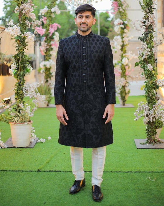 Picture of Black-on-black handworked details on the collar add a touch of glitz to our black embroidered sherwani.