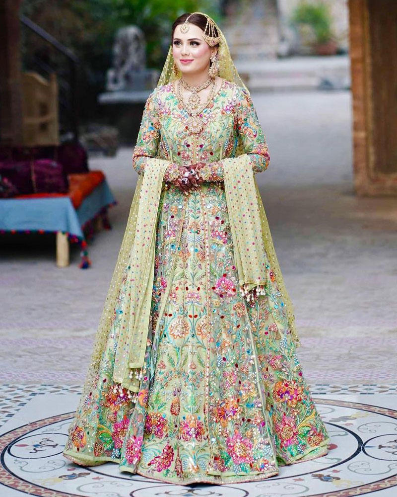 Picture of Bisma in our bespoke apple green jacket and lehnga, with plenty of colour pop!