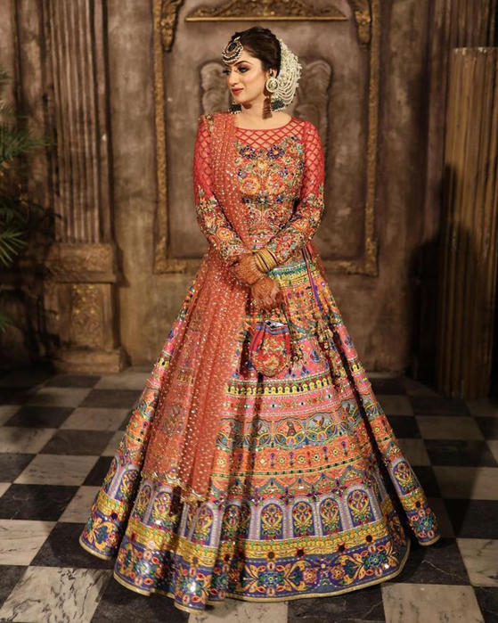 Picture of Sana looks regal in our truck art skirt and sheer handworked choli, all in perfect mehndi colours.