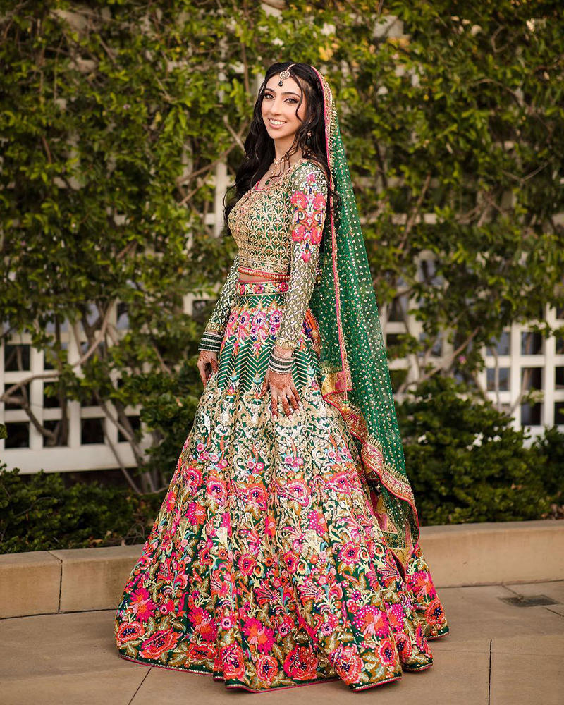 Picture of A bespoke emerald green lehnga choli with our signature statament colour play for Maryam’s mehndi look!