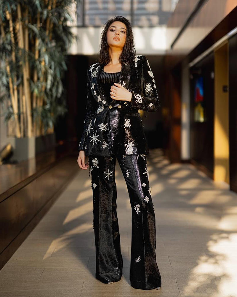 Picture of Ramsha Khan stuns in our black sequined pantsuit that shines with silver mix of celestial and whimsical motifs and white star designs.